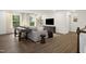 Inviting living room with modern decor, a large sofa, and a game table at 203 Great Smoky Pl, Lillington, NC 27546