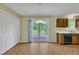 Bright dining area with a sliding door that leads to a deck and a chandelier illuminating the room at 205 Lizzie King Ct, Willow Springs, NC 27592