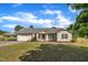 Charming single-story home featuring a well-maintained lawn, attached garage, and inviting front porch with lovely landscaping at 205 Lizzie King Ct, Willow Springs, NC 27592