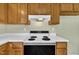 Close-up of the kitchen electric stove top and white vent at 205 Lizzie King Ct, Willow Springs, NC 27592