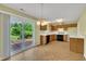 Bright kitchen and dining area with a sliding door that leads to a deck at 205 Lizzie King Ct, Willow Springs, NC 27592