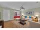 Bright living room with hardwood floors, neutral walls, lots of seating, and bay window with natural light at 205 Lizzie King Ct, Willow Springs, NC 27592