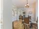 Dining area showcasing hardwood floors and easy access to the staircase and living room at 211 Page St, Morrisville, NC 27560