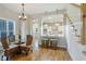 Cozy dining area with views to the kitchen and stairs at 211 Page St, Morrisville, NC 27560