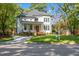 Charming two-story white home with a covered front porch and well-manicured lawn at 211 Page St, Morrisville, NC 27560