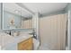 Modern bathroom with stylish vanity, sleek lighting, and elegant shower curtain at 223 Hawthorne Rd, Raleigh, NC 27605