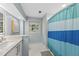 Light and airy bathroom with sleek fixtures, tiled floors, and a shower with a modern curtain at 223 Hawthorne Rd, Raleigh, NC 27605