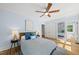 Spacious bedroom with ceiling fan, ample closet space, and sunny windows at 223 Hawthorne Rd, Raleigh, NC 27605