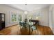 Dining room with modern furniture, hardwood floors, and natural light at 223 Hawthorne Rd, Raleigh, NC 27605