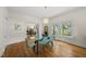Dining room with modern furniture and hardwood floors that connects to living spaces at 223 Hawthorne Rd, Raleigh, NC 27605