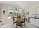 Cozy kitchen dining area with natural light and a desk, plus outside view at 223 Hawthorne Rd, Raleigh, NC 27605