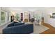 Inviting living room with fireplace, large windows, and comfortable seating arrangement at 223 Hawthorne Rd, Raleigh, NC 27605