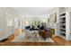 Bright living room with hardwood floors, fireplace, and comfortable seating at 223 Hawthorne Rd, Raleigh, NC 27605