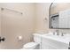 Cozy bathroom with white vanity, modern fixtures, and a framed mirror at 2238 Lakeview Ter, Burlington, NC 27215
