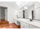 Bright bathroom with a long countertop and multiple sinks, enhanced by modern lighting at 2238 Lakeview Ter, Burlington, NC 27215