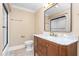 Bathroom featuring a marble vanity and dark wood cabinetry, plus a glass-door shower at 2238 Lakeview Ter, Burlington, NC 27215