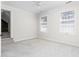 Unfurnished bedroom with neutral carpeting, two windows, and a ceiling fan at 2238 Lakeview Ter, Burlington, NC 27215