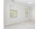 Bright bedroom featuring two large windows that let in plenty of natural light at 2238 Lakeview Ter, Burlington, NC 27215