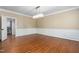 Dining room featuring hardwood floors, wainscoting, modern chandelier and doorway to a bathroom at 2238 Lakeview Ter, Burlington, NC 27215