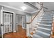 Spacious foyer features hardwood floors, gray walls, elevator access, and stairs to upper level at 2238 Lakeview Ter, Burlington, NC 27215