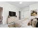 Nicely staged bedroom showcasing a comfortable bed, dresser with TV, and a walk-in closet at 2238 Lakeview Ter, Burlington, NC 27215