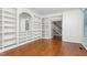 Stylish office space boasts custom shelving, hardwood floors, and natural light at 2238 Lakeview Ter, Burlington, NC 27215