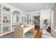 Chic office features custom shelving, desk, hardwood floors, and plenty of natural light at 2238 Lakeview Ter, Burlington, NC 27215