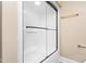 This is a well-lit shower with sliding glass doors and gold hardware at 2238 Lakeview Ter, Burlington, NC 27215