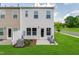 Backyard of a home with green grass, a patio, and two outdoor chairs at 244 Paramount Dr # 24, Smithfield, NC 27577