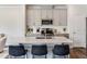 Stylish kitchen island with seating, modern appliances, and sleek cabinets, perfect for entertaining guests at 244 Paramount Dr # 24, Smithfield, NC 27577