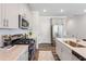 Bright kitchen with stainless steel appliances, light countertops, and wood flooring at 244 Paramount Dr # 24, Smithfield, NC 27577