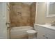Renovated bathroom featuring a tiled shower-tub combo, and a modern vanity with a sink at 2805 Nc 55, Durham, NC 27713