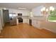 Modern kitchen boasts stainless steel appliances, granite countertops, white cabinets, and hardwood floors at 2805 Nc 55, Durham, NC 27713