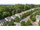 Overhead view of a charming neighborhood with tree-lined streets and well-kept homes at 3002 Remington Oaks Cir, Cary, NC 27519