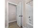 Bathroom featuring a tub, shower, and an open door leading to another room at 3002 Remington Oaks Cir, Cary, NC 27519