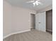 Bedroom with a closet featuring double doors and a ceiling fan at 3002 Remington Oaks Cir, Cary, NC 27519