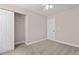 Well-lit bedroom with neutral tones, ceiling fan, and closet with sliding doors at 3002 Remington Oaks Cir, Cary, NC 27519