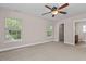 Bedroom featuring an open door leading to a bathroom, and a ceiling fan at 3002 Remington Oaks Cir, Cary, NC 27519