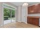 Dining area with wood floors and sliding glass doors leading to the patio at 3002 Remington Oaks Cir, Cary, NC 27519