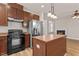 Well-equipped kitchen with wood cabinets and stainless steel appliances at 3002 Remington Oaks Cir, Cary, NC 27519