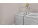 Bright laundry room with a washing machine and dryer ready for use at 3002 Remington Oaks Cir, Cary, NC 27519