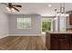 Open living room with wood floors and view of back yard at 3002 Remington Oaks Cir, Cary, NC 27519