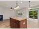 Open living room with access to patio and center island at 3002 Remington Oaks Cir, Cary, NC 27519