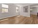 Inviting living space showcasing hardwood floors and abundant natural light from large windows at 3002 Remington Oaks Cir, Cary, NC 27519
