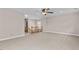 Spacious loft area with ceiling fan and carpet flooring at 3002 Remington Oaks Cir, Cary, NC 27519