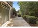 Relaxing patio area with lush greenery and space for outdoor seating and entertainment at 3002 Remington Oaks Cir, Cary, NC 27519