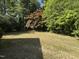 The large backyard is ready for new owners to bring their personal touch to the expansive green space at 306 Holland Rd, Fuquay Varina, NC 27526