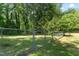 The spacious backyard is enclosed with a chain link fence, offering both security and plenty of room for outdoor activities at 306 Holland Rd, Fuquay Varina, NC 27526