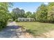 This home features a traditional-style with manicured landscaping, offering beautiful curb appeal at 306 Holland Rd, Fuquay Varina, NC 27526