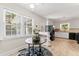 Bright kitchen features a breakfast nook, white cabinets, and views of the outdoors through bright windows at 306 Holland Rd, Fuquay Varina, NC 27526